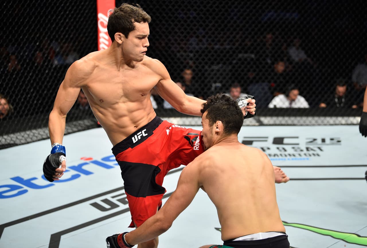 MEXICO CITY, MEXICO - AUGUST 05: (L-R) Humberto Bandenay of Peru knees Martin Bravo of Mexico in their lightweight bout during the UFC Fight Night event at Arena Ciudad de Mexico on August 5, 2017 in Mexico City, Mexico. (Photo by Jeff Bottari/Zuffa LLC/Zuffa LLC via Getty Images)