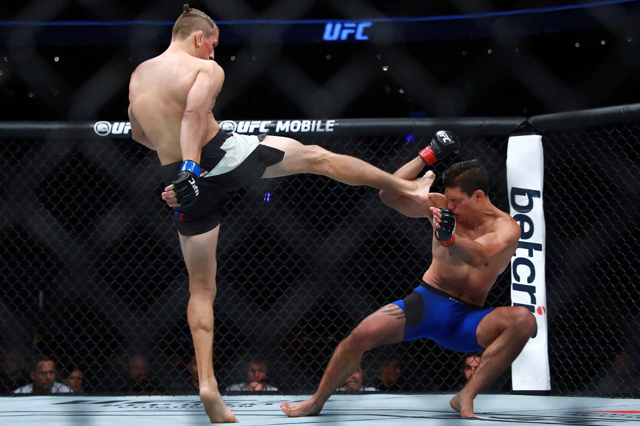 MEXICO CITY, MEXICO - AUGUST 05: Niko Price of United States kicks Alan Jouban of United States during the UFC Fight Night Mexico City at Arena Ciudad de Mexico on August 05, 2017 in Mexico City, Mexico. (Photo by Hector Vivas/Getty Images)