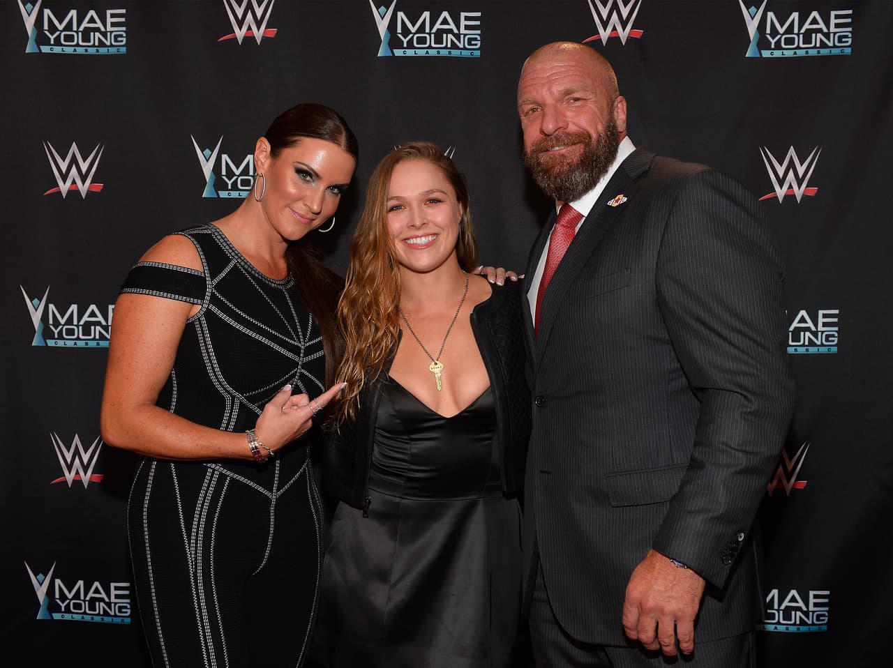 LAS VEGAS, NV - SEPTEMBER 12: (L-R) WWE Chief Brand Officer Stephanie McMahon, MMA fighter Ronda Rousey and WWE Executive Vice President of Talent, Live Events and Creative Paul "Triple H" Levesque appear on the red carpet of the WWE Mae Young Classic on September 12, 2017 in Las Vegas, Nevada. (Photo by Bryan Steffy/Getty Images for WWE)