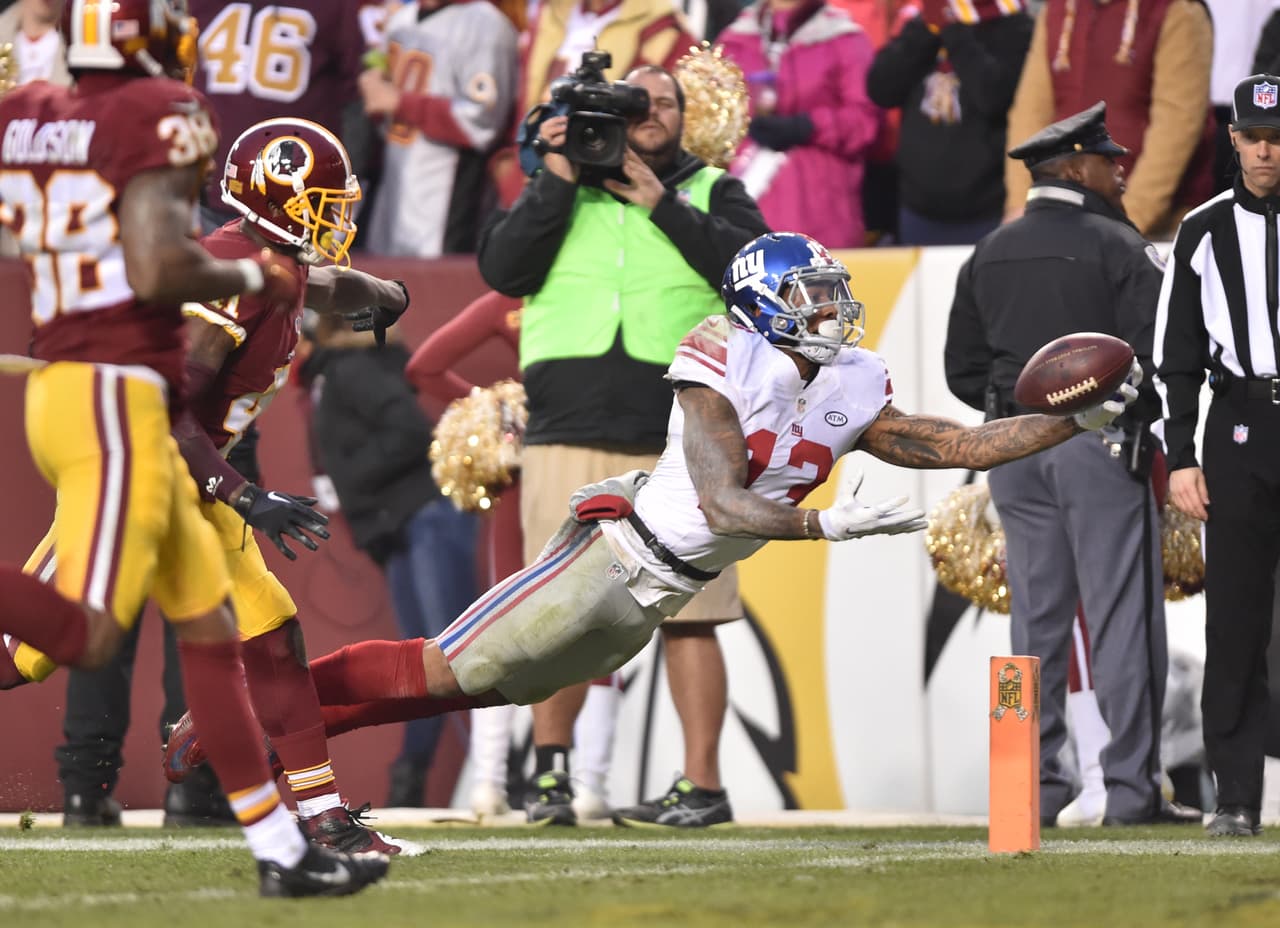 Los Washington Redskins empataron a los New York Giants al tope del Este de la NFC al vencerlos 20-14 en la semana 12, estas son las mejores imágenes de este reñido encuentro.