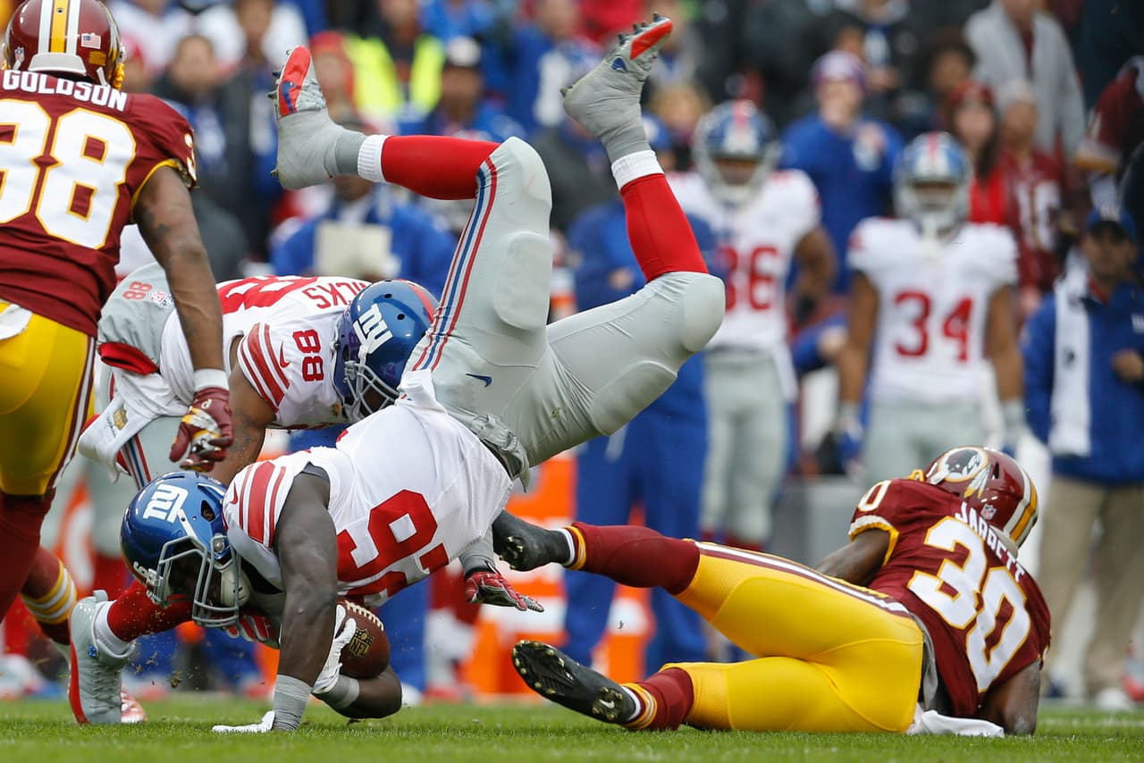 Los Washington Redskins empataron a los New York Giants al tope del Este de la NFC al vencerlos 20-14 en la semana 12, estas son las mejores imágenes de este reñido encuentro.