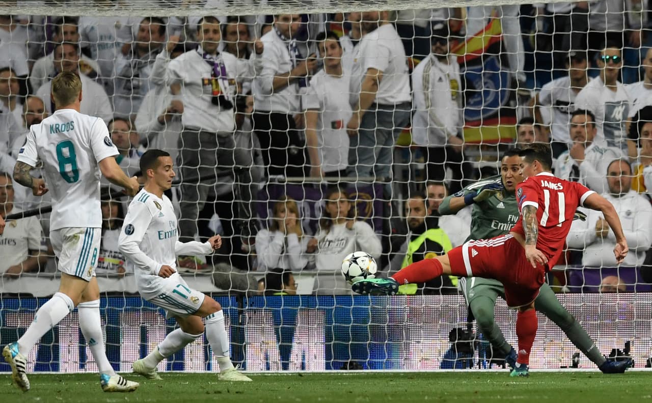 Bayern Munich's Colombian midfielder James Rodriguez (R) tries to score against Real Madrid's Costa Rican goalkeeper Keylor Navas (2nd R) during the UEFA Champions League semi-final second-leg football match Real Madrid CF vs FC Bayern Munich in Madrid, Spain, on May 1, 2018. (Photo by GABRIEL BOUYS / AFP) (Photo credit should read GABRIEL BOUYS/AFP/Getty Images)
