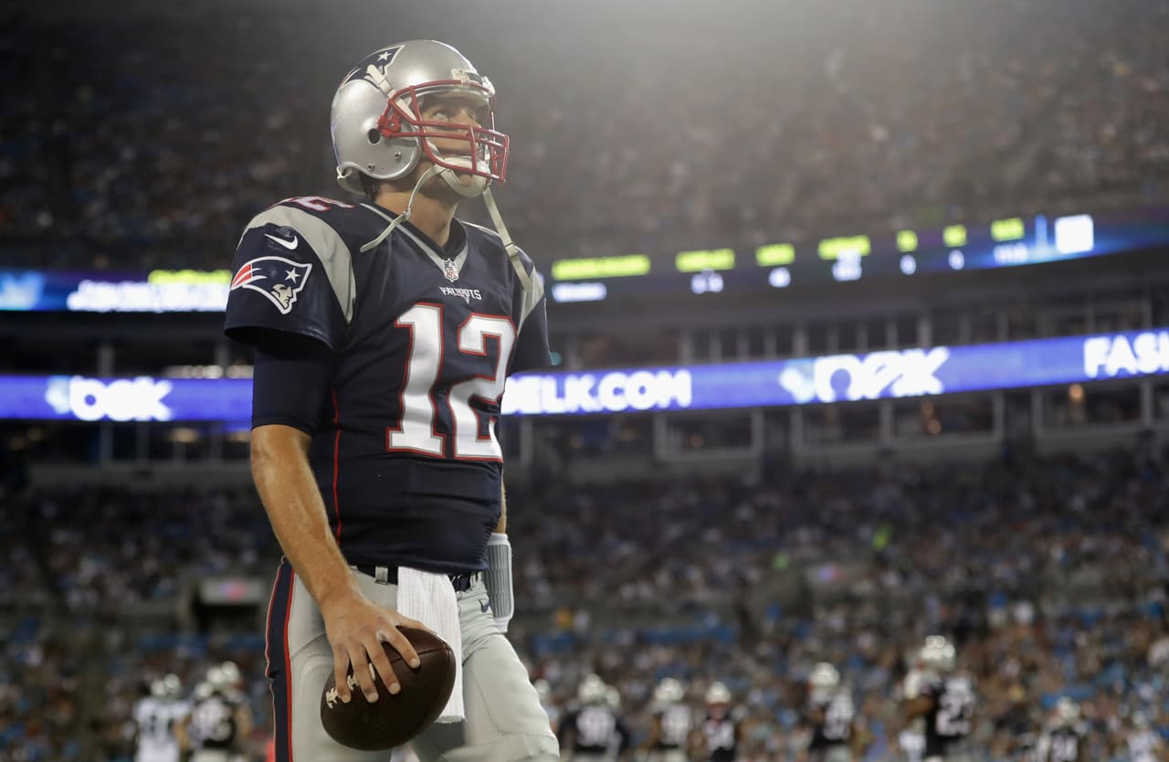 CHARLOTTE, NC - AUGUST 26: Tom Brady #12 of the New England Patriots stays loose on the sideline in the 3rd quarter against the Carolina Panthers at Bank of America Stadium on August 26, 2016 in Charlotte, North Carolina. (Photo by Streeter Lecka/Getty Images)