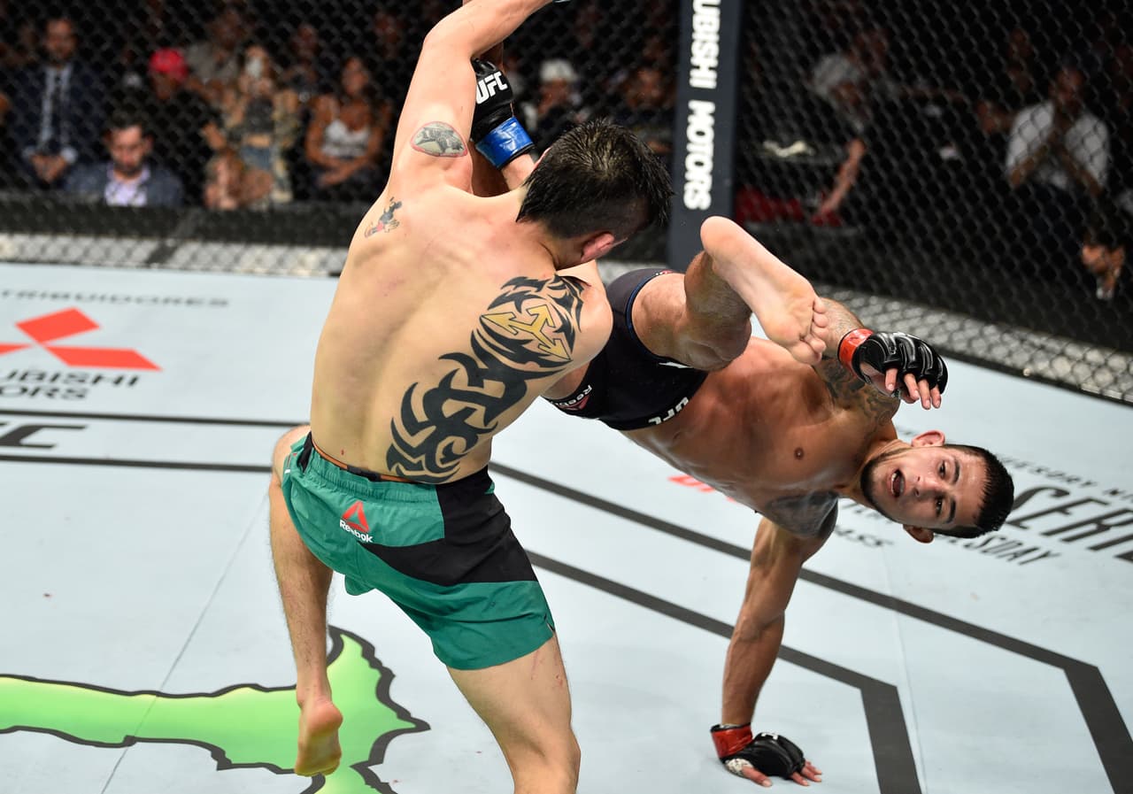 MEXICO CITY, MEXICO - AUGUST 05: (R-L) Sergio Pettis kicks Brandon Moreno of Mexico in their flyweight bout during the UFC Fight Night event at Arena Ciudad de Mexico on August 5, 2017 in Mexico City, Mexico. (Photo by Jeff Bottari/Zuffa LLC/Zuffa LLC via Getty Images)