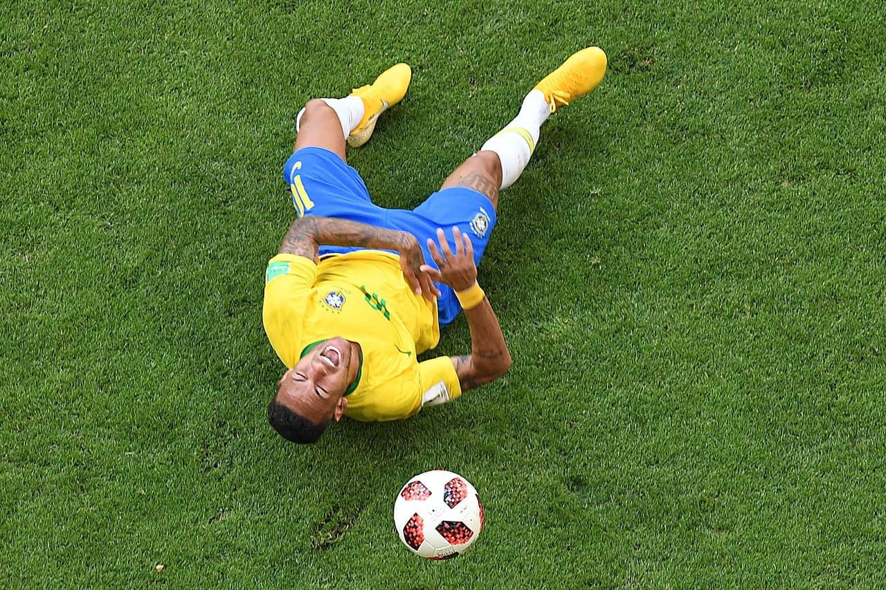Brazil's forward Neymar reacts on the ground after being fouled during the Russia 2018 World Cup round of 16 football match between Brazil and Mexico at the Samara Arena in Samara on July 2, 2018. (Photo by Kirill KUDRYAVTSEV / AFP) / RESTRICTED TO EDITORIAL USE - NO MOBILE PUSH ALERTS/DOWNLOADS (Photo credit should read KIRILL KUDRYAVTSEV/AFP/Getty Images)