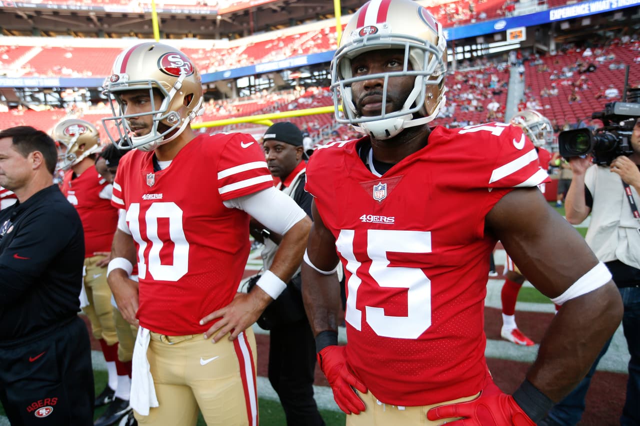Jimmy Garoppolo (izquierda) y no tendrá como compañero a Pierre Garcon (#15) en los San Francisco 49ers.