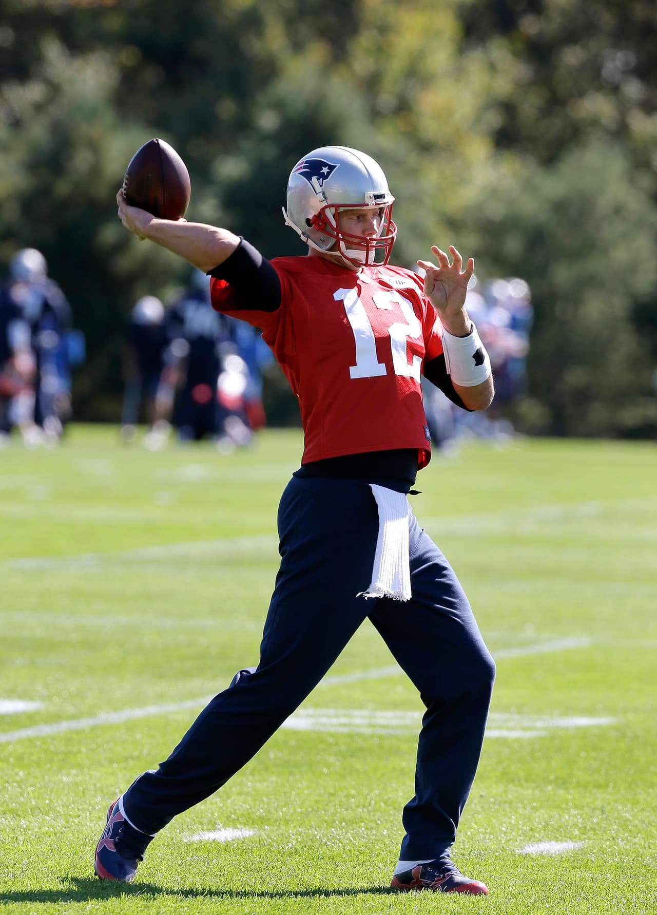 New England Patriots quarterback Tom Brady (12) winds up for a pass during an NFL football team practice Wednesday, Oct. 5, 2016, in Foxborough, Mass. (AP Photo/Steven Senne)