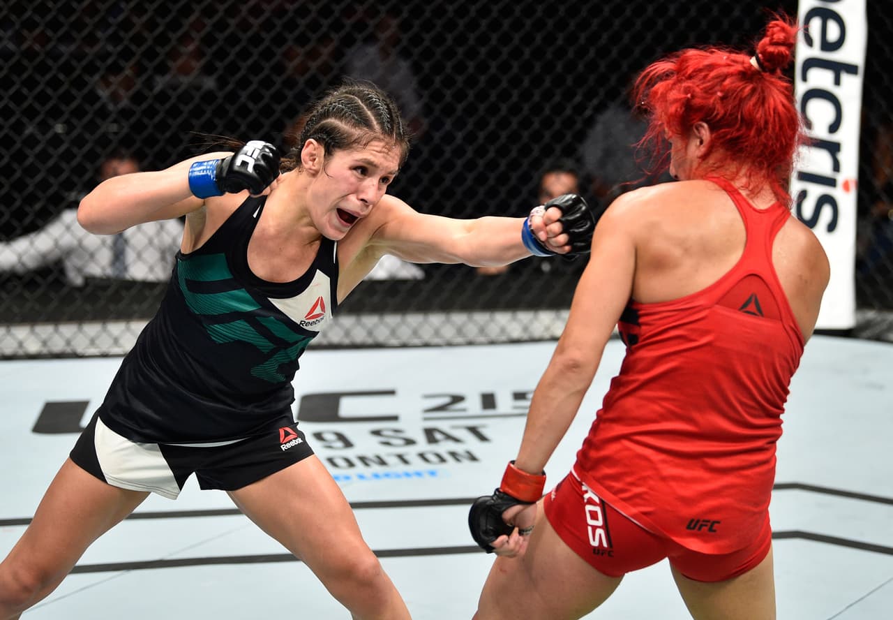 MEXICO CITY, MEXICO - AUGUST 05: (L-R) Alexa Grasso of Mexico punches Randa Markos of Iraq in their women's strawweight bout during the UFC Fight Night event at Arena Ciudad de Mexico on August 5, 2017 in Mexico City, Mexico. (Photo by Jeff Bottari/Zuffa LLC/Zuffa LLC via Getty Images)