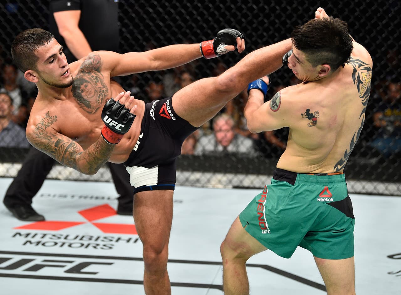 MEXICO CITY, MEXICO - AUGUST 05: (L-R) Sergio Pettis kicks Brandon Moreno of Mexico in their flyweight bout during the UFC Fight Night event at Arena Ciudad de Mexico on August 5, 2017 in Mexico City, Mexico. (Photo by Jeff Bottari/Zuffa LLC/Zuffa LLC via Getty Images)