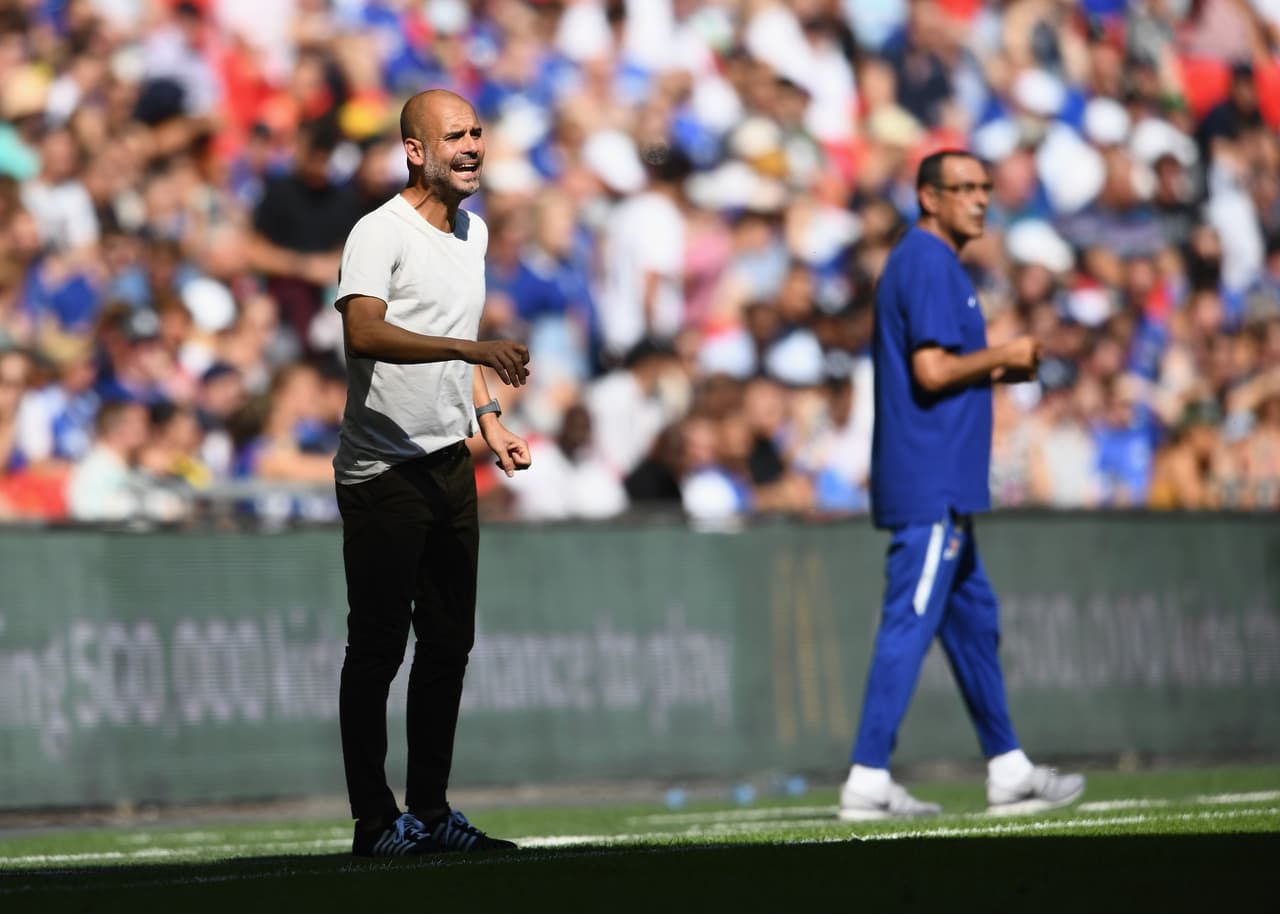 LONDON, ENGLAND - AUGUST 05: Josep Guardiola, Manager of Manchester City reacts alongside Maurizio Sarri, Head Coach of Chelsea during the FA Community Shield between Manchester City and Chelsea at Wembley Stadium on August 5, 2018 in London, England. (Photo by Clive Mason/Getty Images)