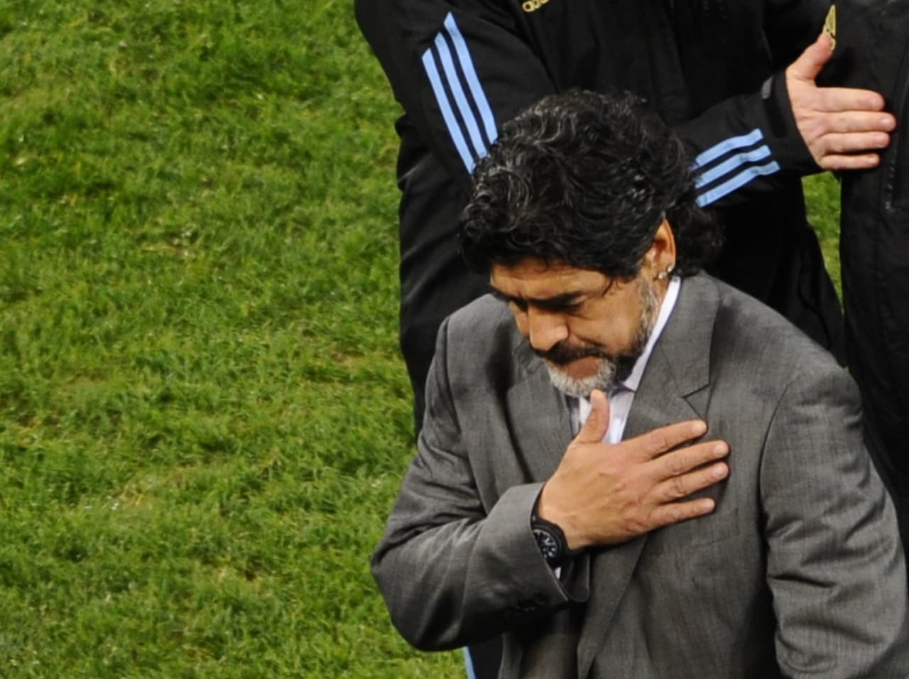 Argentina's coach Diego Maradona looks dejected as he leaves the pitch after his team lost the 2010 World Cup quarter-final football match Argentina vs. Germany on July 3, 2010 at Green Point stadium in Cape Town. Germany qualified for the semi-finals. NO PUSH TO MOBILE / MOBILE USE SOLELY WITHIN EDITORIAL ARTICLE - AFP PHOTO / PIERRE-PHILIPPE MARCOU (Photo credit should read PIERRE-PHILIPPE MARCOU/AFP/Getty Images)