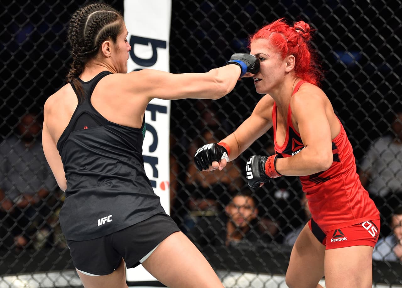 MEXICO CITY, MEXICO - AUGUST 05: (L-R) Alexa Grasso of Mexico punches Randa Markos of Iraq in their women's strawweight bout during the UFC Fight Night event at Arena Ciudad de Mexico on August 5, 2017 in Mexico City, Mexico. (Photo by Jeff Bottari/Zuffa LLC/Zuffa LLC via Getty Images)