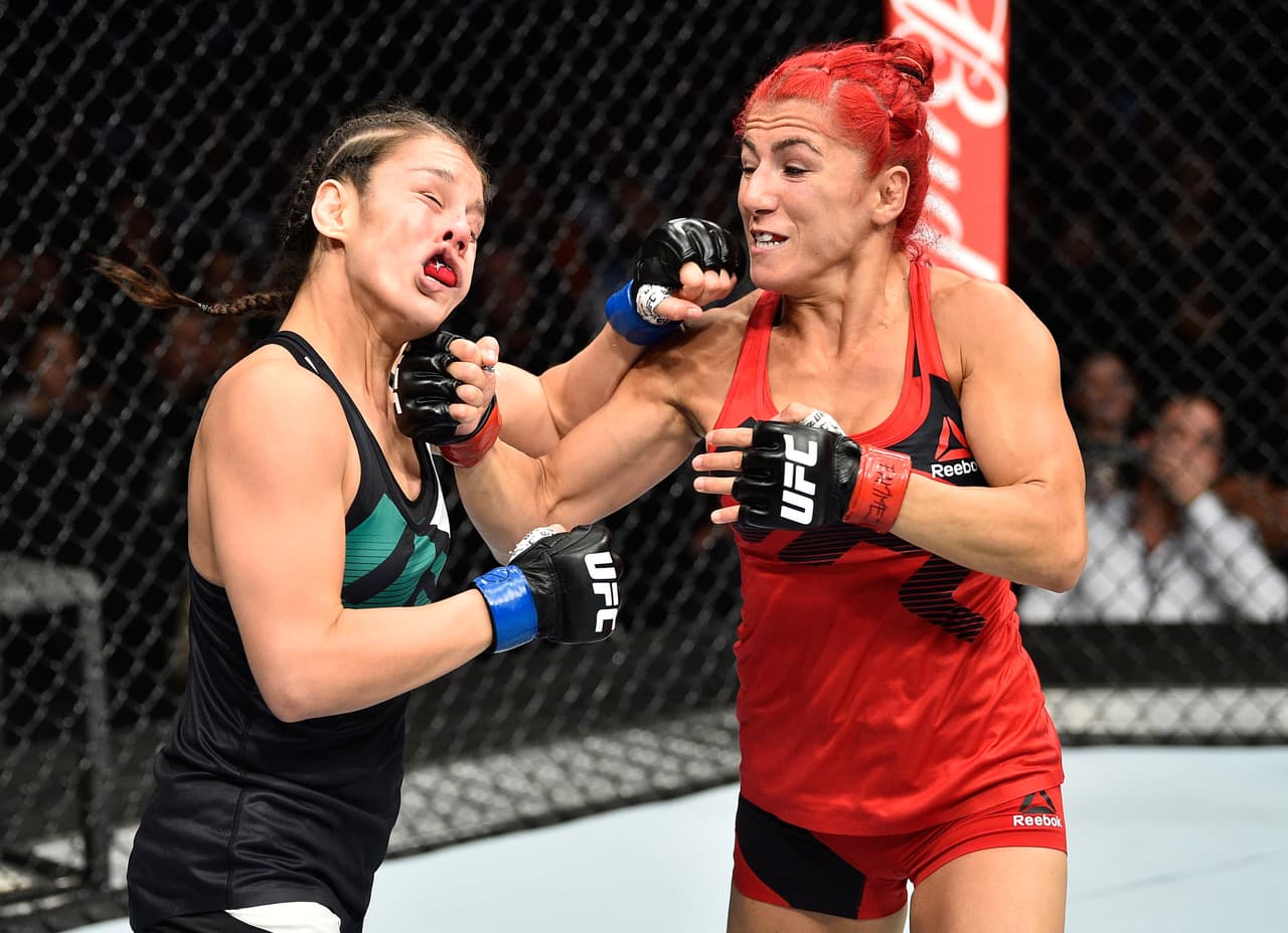 MEXICO CITY, MEXICO - AUGUST 05: (R-L) Randa Markos of Iraq punches Alexa Grasso of Mexico in their women's strawweight bout during the UFC Fight Night event at Arena Ciudad de Mexico on August 5, 2017 in Mexico City, Mexico. (Photo by Jeff Bottari/Zuffa LLC/Zuffa LLC via Getty Images)