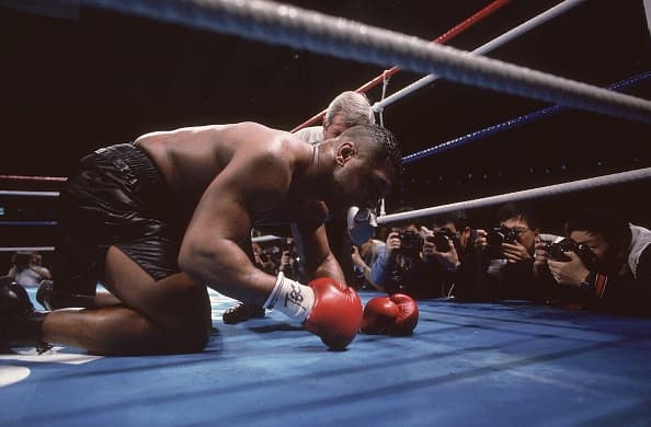 Boxing: WBC/ WBA/ IBF Heavyweight Title: Mike Tyson down on canvas during bout vs James Buster Douglas at Tokyo Dome.Tyson is defeated by Douglas by 10th round knockout for his first professional loss. Tokyo, Japan 2/11/1990 CREDIT: Takeo Tanuma (Photo by Takeo Tanuma /Sports Illustrated/Getty Images) (Set Number: X39367 TK1 R8 F9 )
