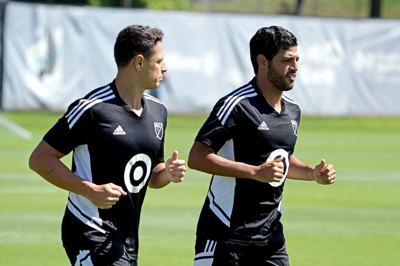 Aug 8, 2022; Blaine, MN, USA; MLS All-Star player Carlos Vela and Chicharito during the 2022 MLS All-Star Game Training and Media at National Sports Center. Mandatory Credit: Kirby Lee-USA TODAY Sports