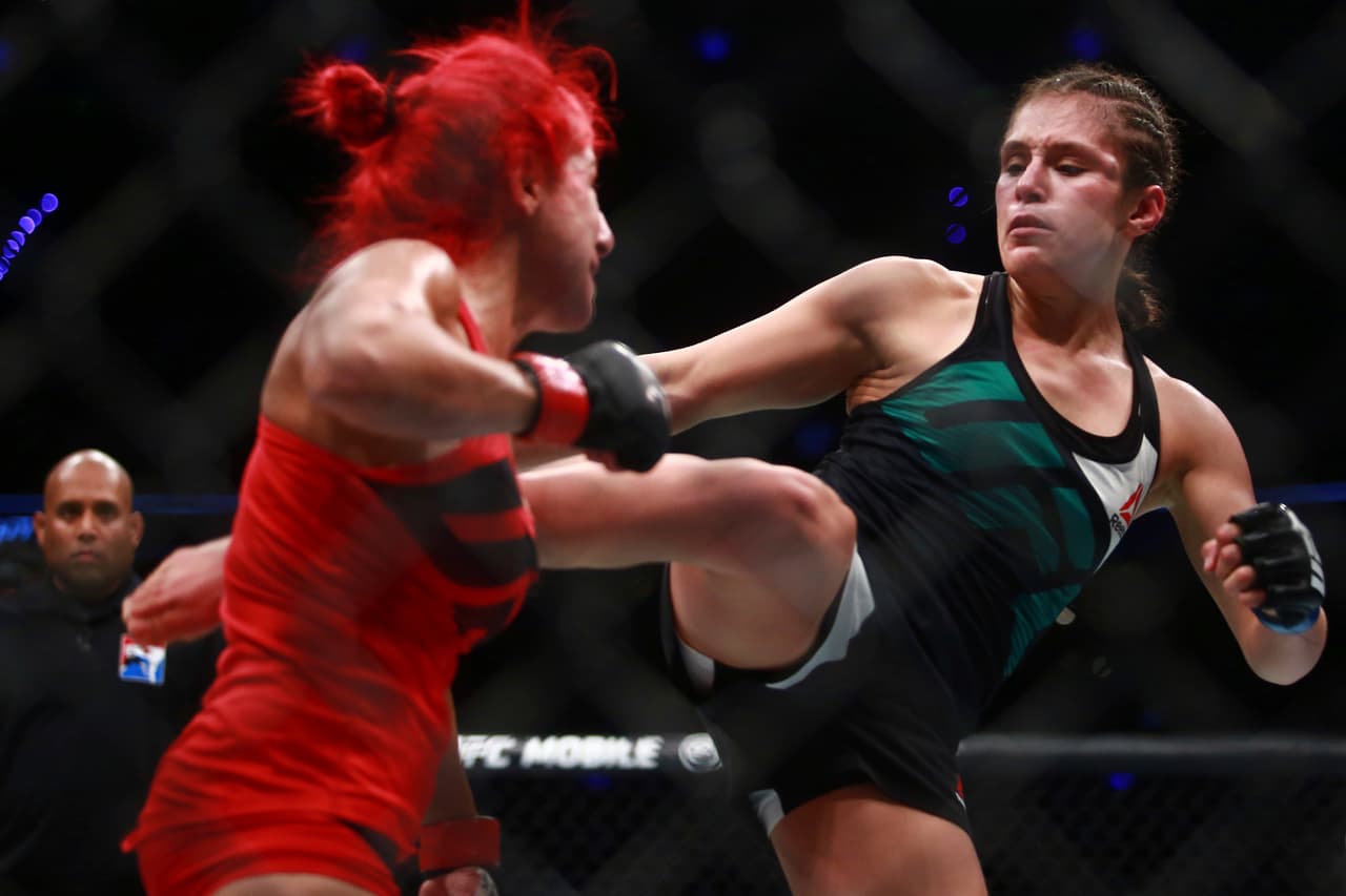 MEXICO CITY, MEXICO - AUGUST 05: Alexa Grasso of Mexico punches Randa Markos of Canada during the UFC Fight Night Mexico City at Arena Ciudad de Mexico on August 05, 2017 in Mexico City, Mexico. (Photo by Hector Vivas/Getty Images)
