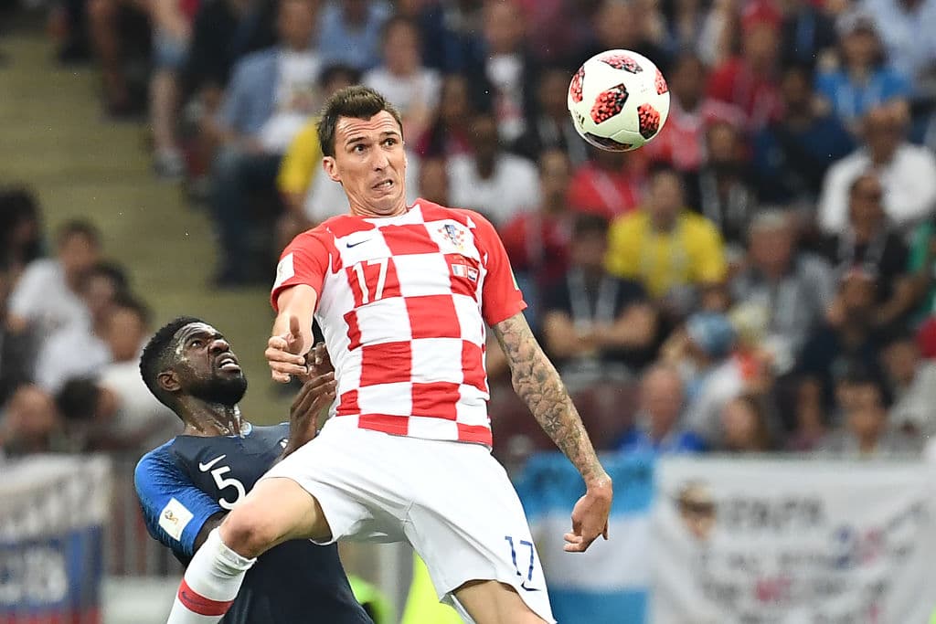 TOPSHOT - Croatia's forward Mario Mandzukic (R) vies with France's defender Samuel Umtiti during their Russia 2018 World Cup final football match between France and Croatia at the Luzhniki Stadium in Moscow on July 15, 2018. (Photo by FRANCK FIFE / AFP) / RESTRICTED TO EDITORIAL USE - NO MOBILE PUSH ALERTS/DOWNLOADS (Photo credit should read FRANCK FIFE/AFP/Getty Images)