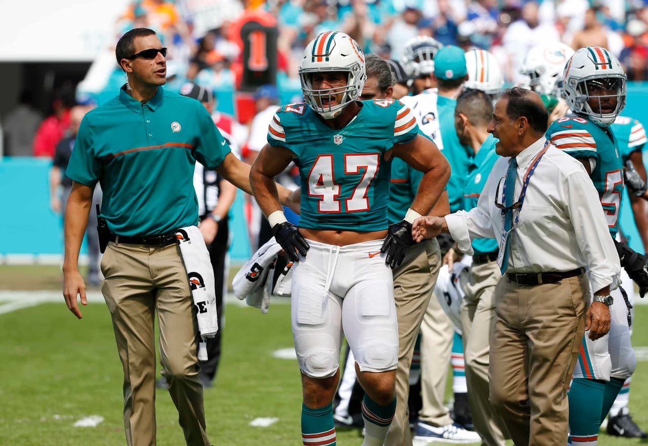 Miami Dolphins middle linebacker Kiko Alonso (47) is helped off the field, during the first half of an NFL football game against the Buffalo Bills, Sunday, Oct. 23, 2016, in Miami Gardens, Fla. (AP Photo/Wilfredo Lee)