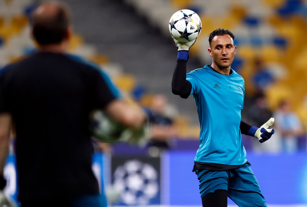 Real Madrid's goalkeeper Keylor Navas holds the ball during a training session at the Olimpiyskiy Stadium in Kiev, Ukraine, Friday, May 25, 2018 ahead of the Champions League final soccer match between Real Madrid and Liverpool on Saturday May 26. (AP Photo/Matthias Schrader)