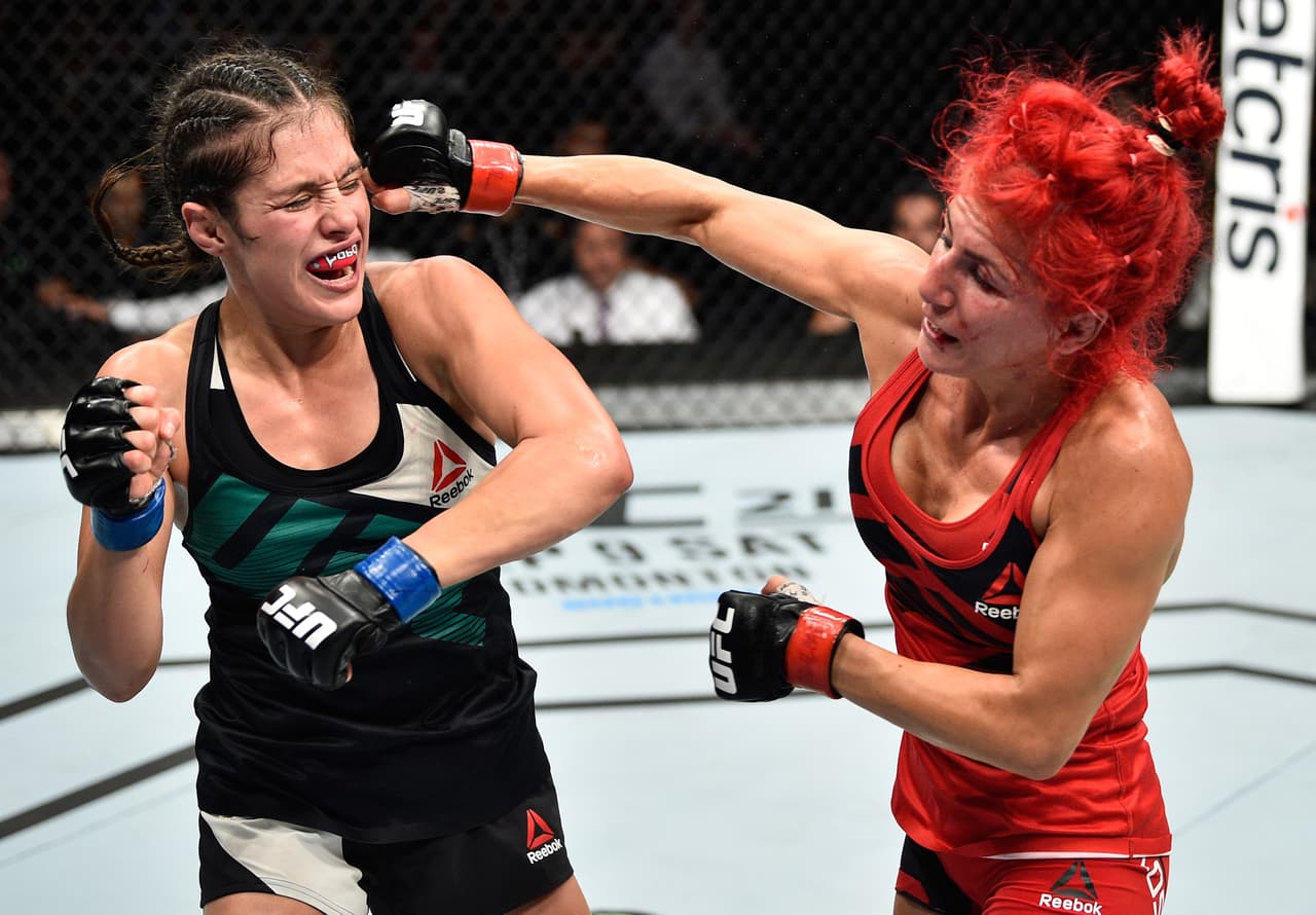 MEXICO CITY, MEXICO - AUGUST 05: (R-L)) Randa Markos of Iraq punches Alexa Grasso of Mexico in their women's strawweight bout during the UFC Fight Night event at Arena Ciudad de Mexico on August 5, 2017 in Mexico City, Mexico. (Photo by Jeff Bottari/Zuffa LLC/Zuffa LLC via Getty Images)