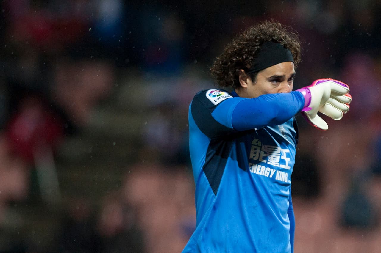 Granada's Mexican goalkeeper Guillermo Ochoa wipes his face during the Spanish league football match Granada CF vs Real Sociedad at Nuevo Los Carmenes stadium in Granada on December 17, 2016. / AFP / JORGE GUERRERO (Photo credit should read JORGE GUERRERO/AFP/Getty Images)