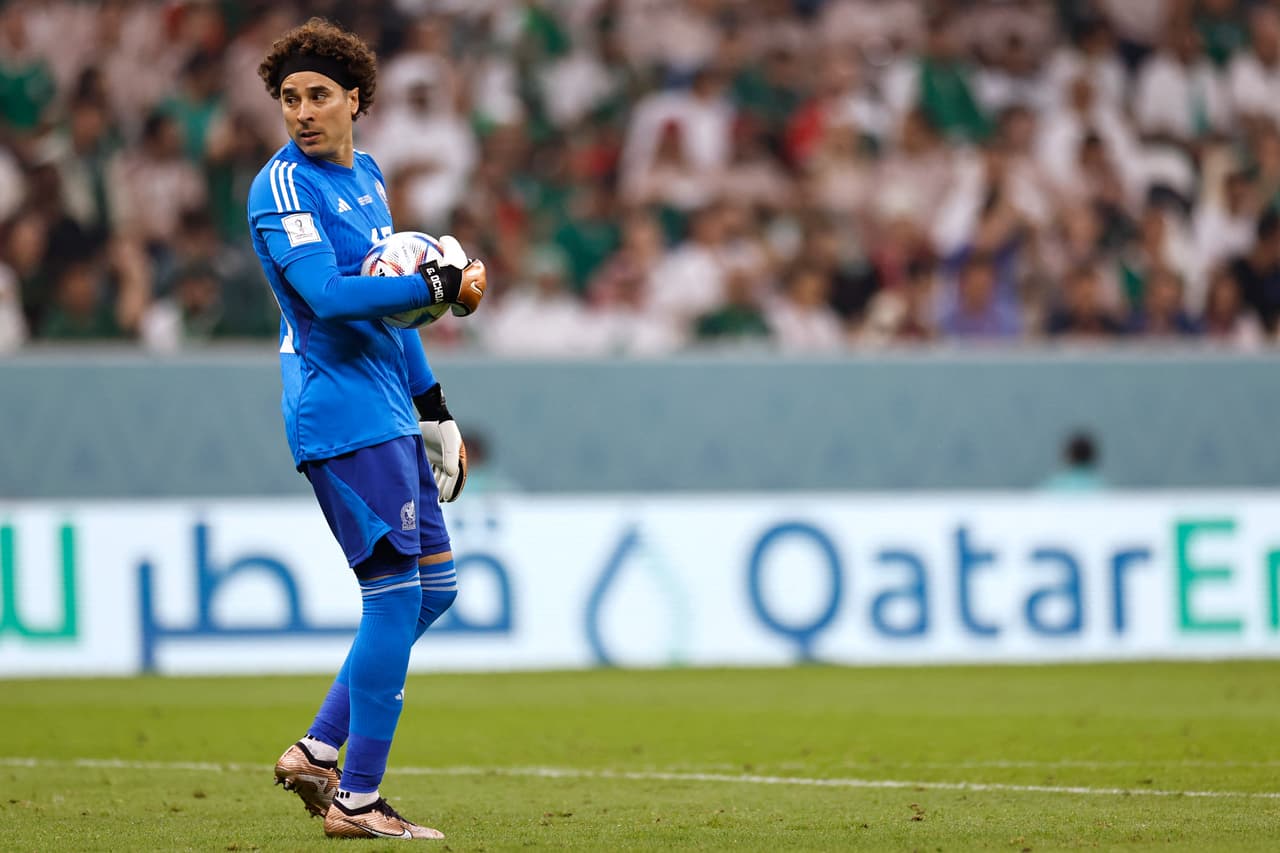 Mexico's goalkeeper #13 Guillermo Ochoa holds the ball during the Qatar 2022 World Cup Group C football match between Saudi Arabia and Mexico at the Lusail Stadium in Lusail, north of Doha on November 30, 2022. (Photo by Khaled DESOUKI / AFP) (Photo by KHALED DESOUKI/AFP via Getty Images)