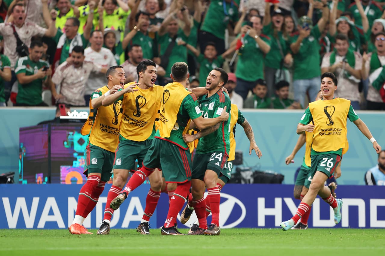 LUSAIL CITY, QATAR - NOVEMBER 30: Luis Chavez of Mexico celebrates with teammates after scoring their team's second goal during the FIFA World Cup Qatar 2022 Group C match between Saudi Arabia and Mexico at Lusail Stadium on November 30, 2022 in Lusail City, Qatar. (Photo by Francois Nel/Getty Images)