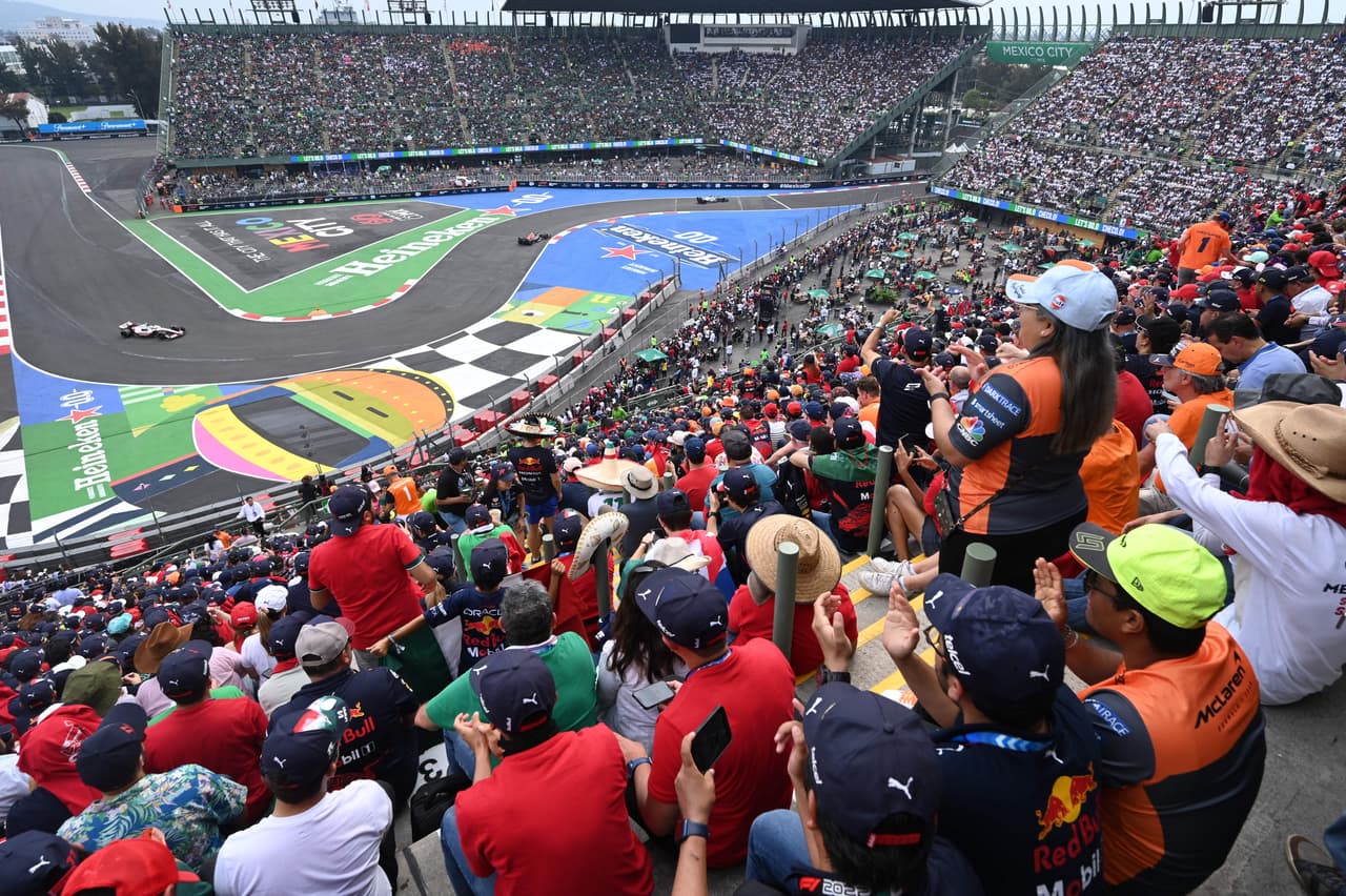 Spectators watch the Formula One Mexico Grand Prix at the Hermanos Rodriguez racetrack in Mexico City on October 30, 2022. (Photo by RODRIGO ARANGUA / AFP) (Photo by RODRIGO ARANGUA/AFP via Getty Images)
