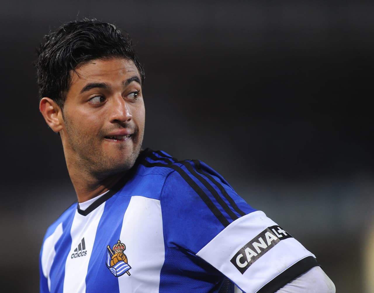 Real Sociedad's Mexican forward Carlos Vela looks over his shoulder during the Spanish league football match Real Sociedad vs Atletico de Madrid at the Anoeta stadium in San Sebastian on November 9, 2014. Real Sociedad won 2-1. AFP PHOTO/ RAFA RIVAS (Photo credit should read RAFA RIVAS/AFP/Getty Images)