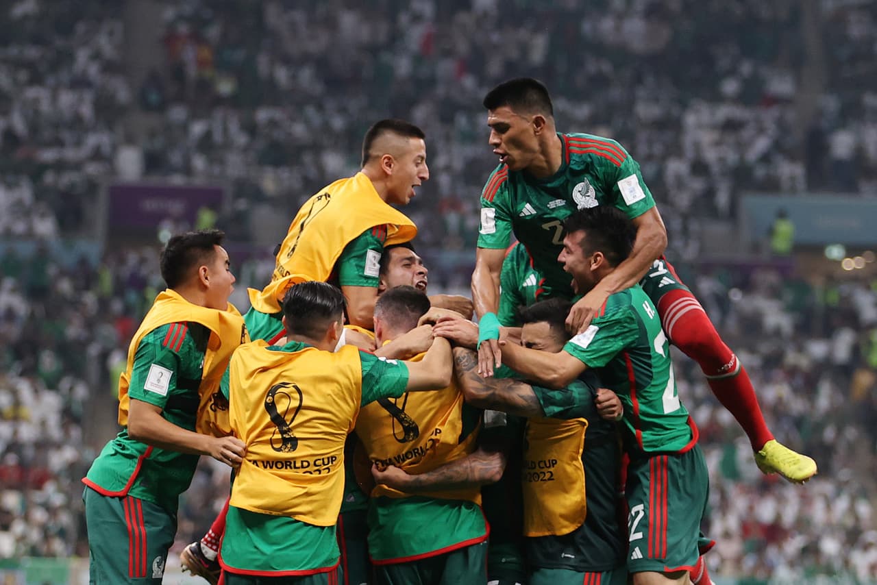 LUSAIL CITY, QATAR - NOVEMBER 30: Luis Chavez of Mexico celebrates with teammates after scoring their team's second goal during the FIFA World Cup Qatar 2022 Group C match between Saudi Arabia and Mexico at Lusail Stadium on November 30, 2022 in Lusail City, Qatar. (Photo by Michael Steele/Getty Images)