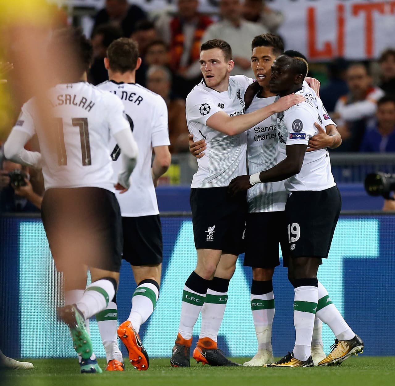 ROME, ITALY - MAY 02: Sadio Mane' with his teammates of Liverpool celebrates after scoring the opening goal during the UEFA Champions League Semi Final Second Leg match between A.S. Roma and Liverpool at Stadio Olimpico on May 2, 2018 in Rome, Italy. (Photo by Paolo Bruno/Getty Images)
