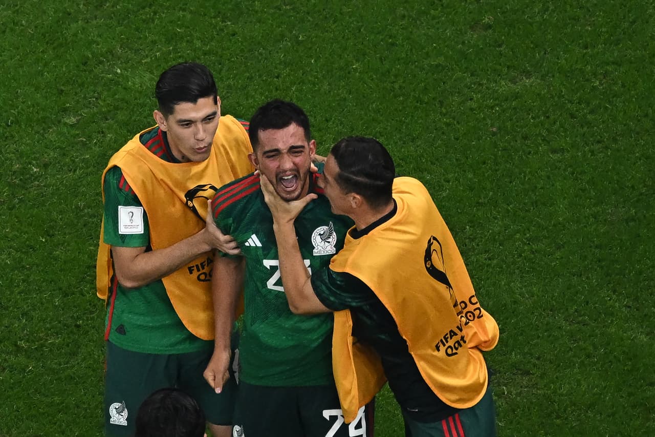 Mexico's midfielder #24 Luis Chavez celebrates with teammates after scoring his team's second goal from a free-kick during the Qatar 2022 World Cup Group C football match between Saudi Arabia and Mexico at the Lusail Stadium in Lusail, north of Doha on November 30, 2022. (Photo by MANAN VATSYAYANA / AFP) (Photo by MANAN VATSYAYANA/AFP via Getty Images)