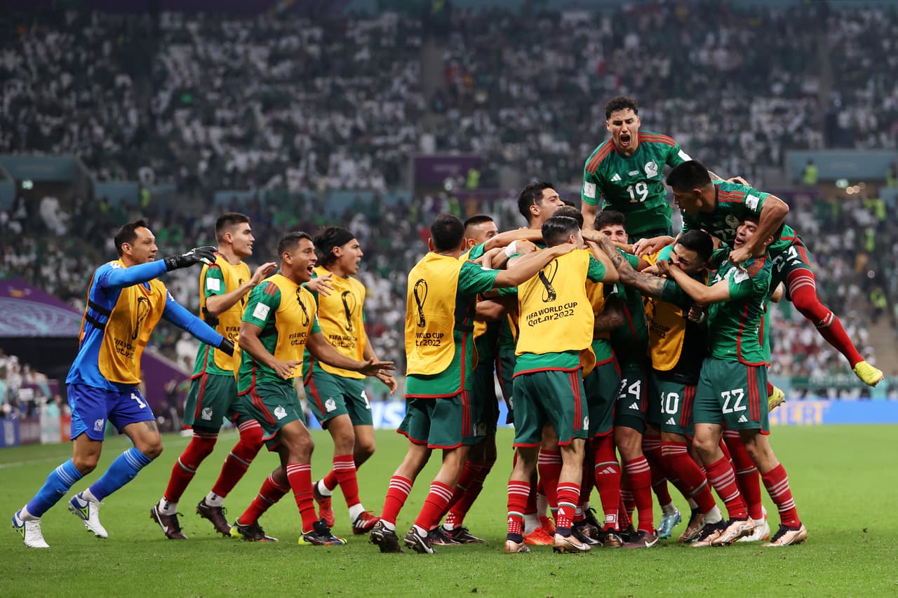 LUSAIL CITY, QATAR - NOVEMBER 30: Luis Chavez of Mexico celebrates with teammates after scoring their team's second goal during the FIFA World Cup Qatar 2022 Group C match between Saudi Arabia and Mexico at Lusail Stadium on November 30, 2022 in Lusail City, Qatar. (Photo by Michael Steele/Getty Images)